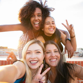 Three women are laughing and having a good time
