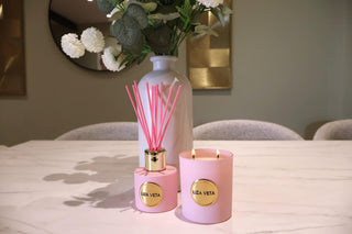 natural candle and reed diffuser in kitchen