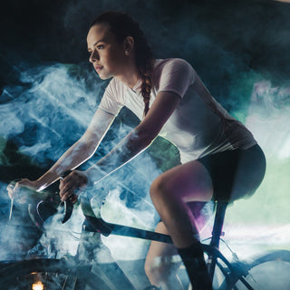 A woman is on the bicycle after using energise and focus natural scents.